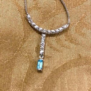 Lovely dainty pendant in silver with white and blue topaz cz stones